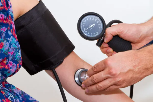 Doctor checking Patients Blood pressure